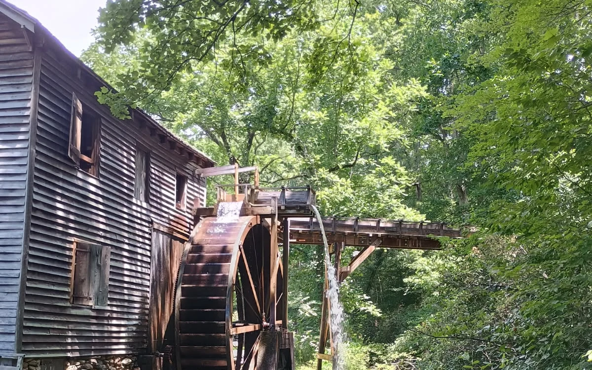 Historic water mill with a wooden waterwheel